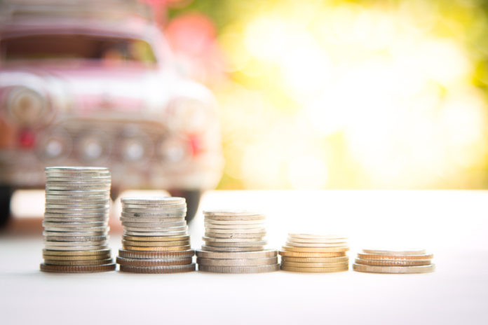 car and money with rays light flare , concept of car loan