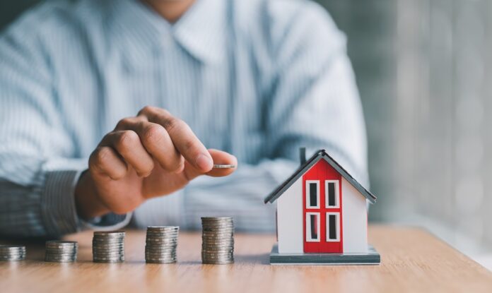stack of money and home models, home insurance ideas and insuran